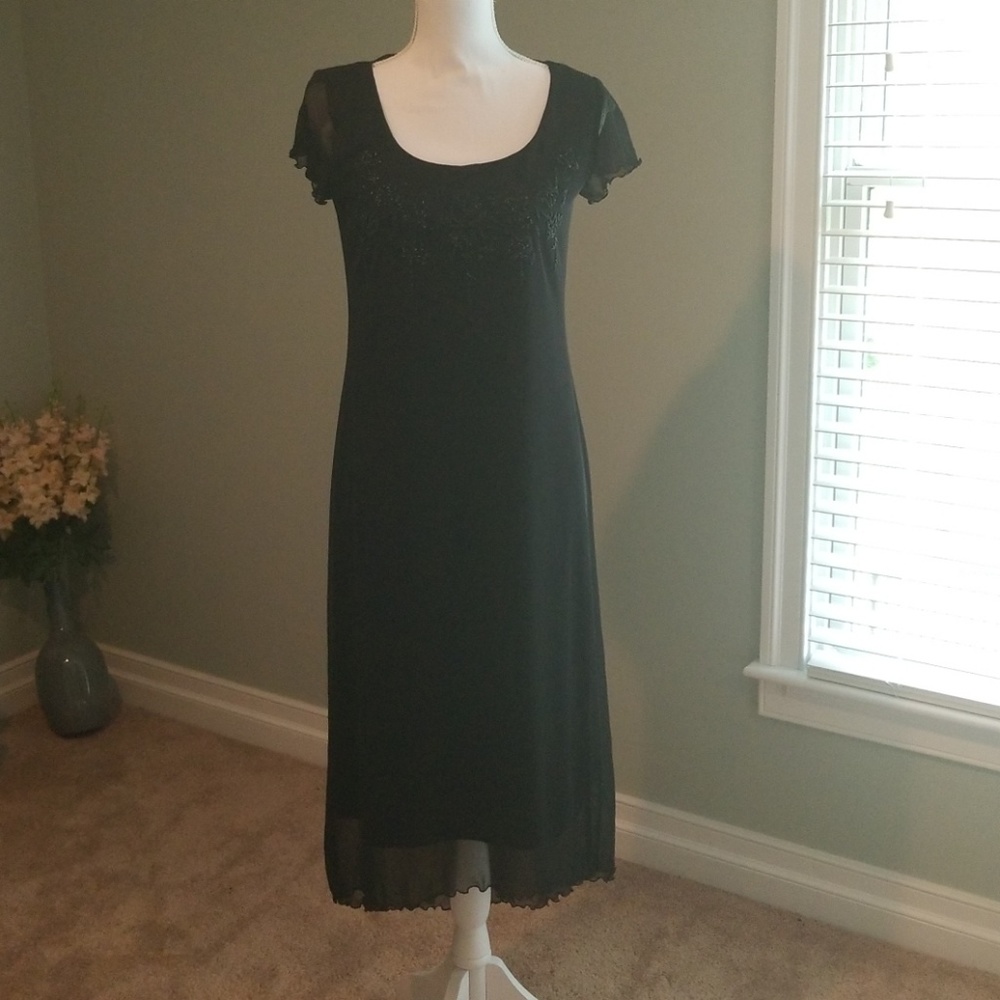 Beautiful cocktail black dress! New without taggs